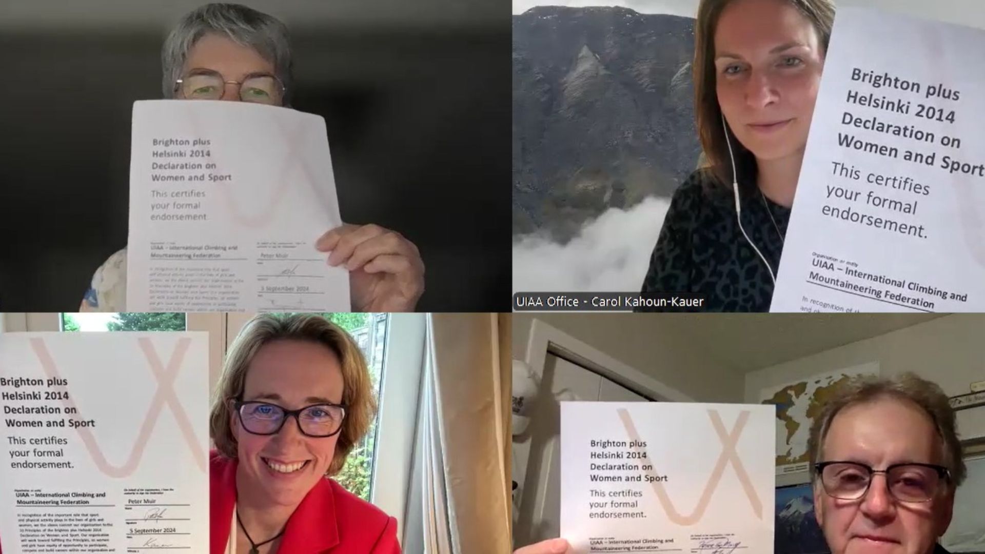 A screenshot of 4 people on a video call. They are Peter Muir, Carol Kahoun and Francoise Jacquet of the UIAA, and Lisa O'Keefe MBE from IWG women and sport. They are holding signed copies of the Brighton Plus Helsinki Declaration certificate up to the camera