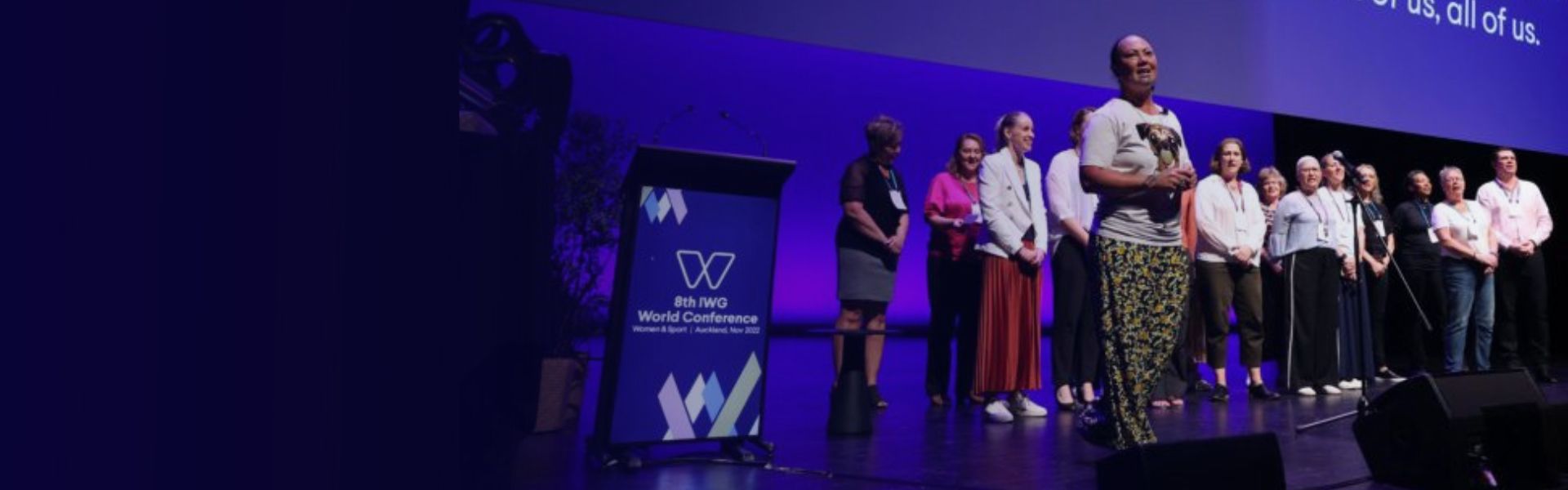 Image of a group of women speakers on stage at the New Zealand IWG World Summit on gender equity and equality on women and sport